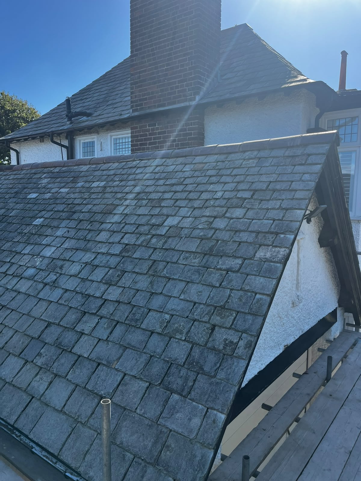Original grey natural slate roof under scaffold, ready for heritage re-slating by RTC Roofing