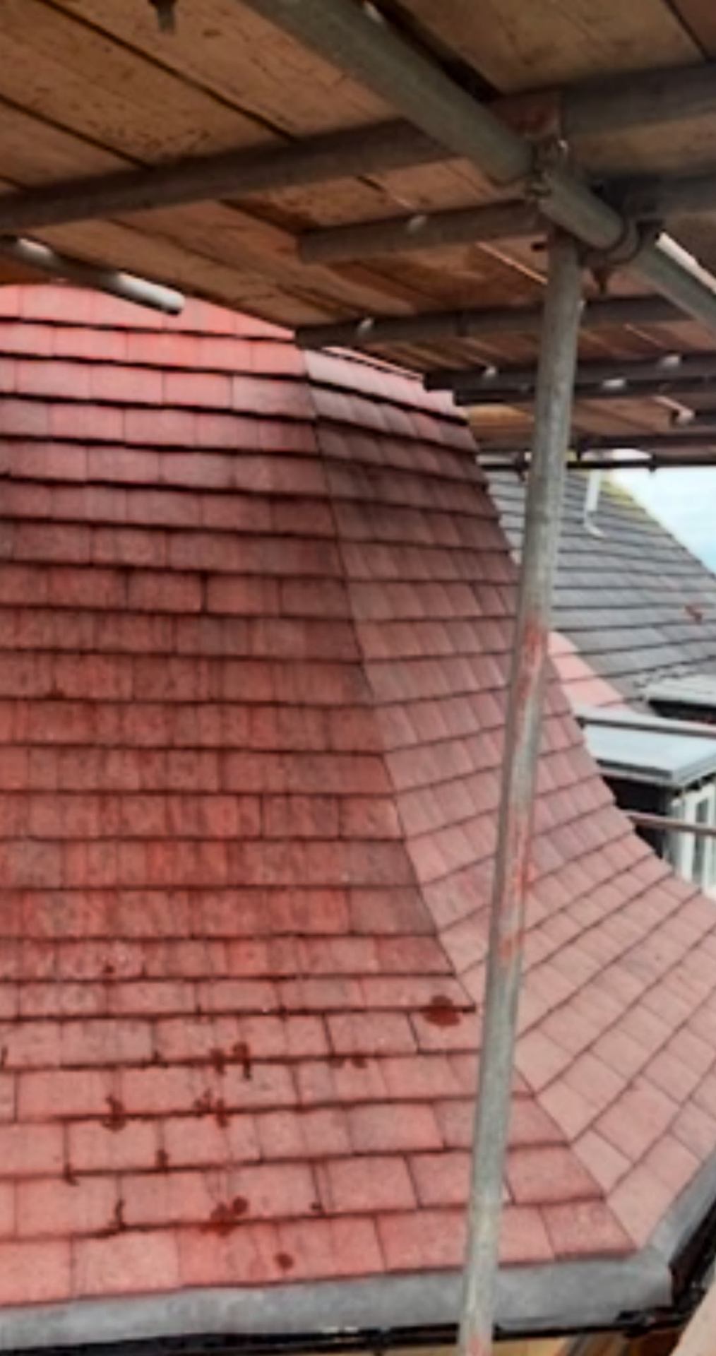 Heritage red clay tile detail on a curved bay roof, restored by RTC Roofing on a Wirral period property